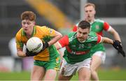 18 November 2023; Patrick Egan of Corofin in action against James Doherty of Ballina Stephenites during the AIB Connacht GAA Football Senior Club Championship Semi-Final match between Corofin, Galway, and Ballina Stephenites, Mayo, at Pearse Stadium, Galway. Photo by Ray Ryan/Sportsfile