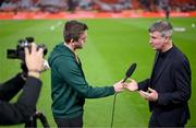 18 November 2023; Republic of Ireland manager Stephen Kenny, right, is interviewed by FAI communications manager Kieran Crowley before the UEFA EURO 2024 Championship qualifying group B match between Netherlands and Republic of Ireland at Johan Cruijff ArenA in Amsterdam, Netherlands. Photo by Stephen McCarthy/Sportsfile