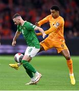 18 November 2023; Alan Browne of Republic of Ireland in action against Cody Gakpo of Netherlands during the UEFA EURO 2024 Championship qualifying group B match between Netherlands and Republic of Ireland at Johan Cruijff ArenA in Amsterdam, Netherlands. Photo by Stephen McCarthy/Sportsfile