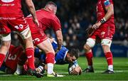 18 November 2023; Max Deegan of Leinster dives over to score his side's third try during the United Rugby Championship match between Leinster and Scarlets at the RDS Arena in Dublin. Photo by Harry Murphy/Sportsfile