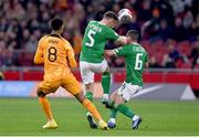 18 November 2023; Dara O'Shea, 5, and Josh Cullen of Republic of Ireland collide during the UEFA EURO 2024 Championship qualifying group B match between Netherlands and Republic of Ireland at Johan Cruijff ArenA in Amsterdam, Netherlands. Photo by Stephen McCarthy/Sportsfile