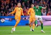 18 November 2023; Alan Browne of Republic of Ireland has a shot on goal despite the attention of Quilindschy Hartman, left, and Tijjani Reijnders of Netherlands during the UEFA EURO 2024 Championship qualifying group B match between Netherlands and Republic of Ireland at Johan Cruijff ArenA in Amsterdam, Netherlands. Photo by Seb Daly/Sportsfile
