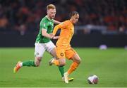 18 November 2023; Xavi Simons of Netherlands in action against Liam Scales of Republic of Ireland during the UEFA EURO 2024 Championship qualifying group B match between Netherlands and Republic of Ireland at Johan Cruijff ArenA in Amsterdam, Netherlands. Photo by Seb Daly/Sportsfile