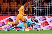 18 November 2023; Republic of Ireland goalkeeper Gavin Bazunu makes a save ahead of Cody Gakpo of Netherlands during the UEFA EURO 2024 Championship qualifying group B match between Netherlands and Republic of Ireland at Johan Cruijff ArenA in Amsterdam, Netherlands. Photo by Seb Daly/Sportsfile