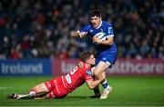 18 November 2023; Jimmy O'Brien of Leinster is tackled by Kieran Hardy of Scarlets during the United Rugby Championship match between Leinster and Scarlets at the RDS Arena in Dublin. Photo by Sam Barnes/Sportsfile