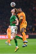 18 November 2023; Liam Scales of Republic of Ireland in action against Denzel Dumfries of Netherlands during the UEFA EURO 2024 Championship qualifying group B match between Netherlands and Republic of Ireland at Johan Cruijff ArenA in Amsterdam, Netherlands. Photo by Seb Daly/Sportsfile