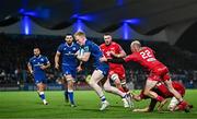 18 November 2023; Jamie Osborne of Leinster evades the tackle of Ioan Nicholas of Scarlets on his way to scoring his side's fifth try during the United Rugby Championship match between Leinster and Scarlets at the RDS Arena in Dublin. Photo by Harry Murphy/Sportsfile