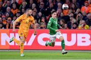 18 November 2023; Jamie McGrath of Republic of Ireland in action against Stefan de Vrij of Netherlands during the UEFA EURO 2024 Championship qualifying group B match between Netherlands and Republic of Ireland at Johan Cruijff ArenA in Amsterdam, Netherlands. Photo by Stephen McCarthy/Sportsfile