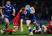 18 November 2023; Fintan Gunne of Leinster is tackled by Jonathan Davies of Scarlets during the United Rugby Championship match between Leinster and Scarlets at the RDS Arena in Dublin. Photo by Harry Murphy/Sportsfile
