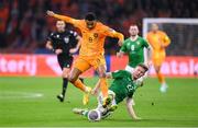 18 November 2023; Cody Gakpo of Netherlands is tackled by Nathan Collins of Republic of Ireland during the UEFA EURO 2024 Championship qualifying group B match between Netherlands and Republic of Ireland at Johan Cruijff ArenA in Amsterdam, Netherlands. Photo by Seb Daly/Sportsfile