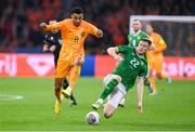 18 November 2023; Cody Gakpo of Netherlands is tackled by Nathan Collins of Republic of Ireland during the UEFA EURO 2024 Championship qualifying group B match between Netherlands and Republic of Ireland at Johan Cruijff ArenA in Amsterdam, Netherlands. Photo by Seb Daly/Sportsfile