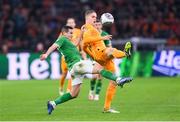 18 November 2023; Joey Veerman of Netherlands in action against Josh Cullen of Republic of Ireland during the UEFA EURO 2024 Championship qualifying group B match between Netherlands and Republic of Ireland at Johan Cruijff ArenA in Amsterdam, Netherlands. Photo by Seb Daly/Sportsfile