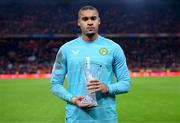 18 November 2023; Republic of Ireland goalkeeper Gavin Bazunu with his Player of the match trophy after the UEFA EURO 2024 Championship qualifying group B match between Netherlands and Republic of Ireland at Johan Cruijff ArenA in Amsterdam, Netherlands. Photo by Stephen McCarthy/Sportsfile