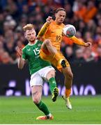18 November 2023; Xavi Simons of Netherlands and Liam Scales of Republic of Ireland during the UEFA EURO 2024 Championship qualifying group B match between Netherlands and Republic of Ireland at Johan Cruijff ArenA in Amsterdam, Netherlands. Photo by Stephen McCarthy/Sportsfile