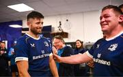 18 November 2023; Ross Byrne of Leinster is congratulated by teammate Tadhg Furlong in the dressing room after making his 150th Leinster appearance and scoring his 1000th point during the United Rugby Championship match between Leinster and Scarlets at the RDS Arena in Dublin. Photo by Harry Murphy/Sportsfile