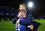 18 November 2023; Fintan Gunne of Leinster is embraced by teammate Sam Prendergast after making his debut in the United Rugby Championship match between Leinster and Scarlets at the RDS Arena in Dublin. Photo by Harry Murphy/Sportsfile
