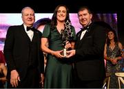 18 November 2023; Hannah Tyrrell of Dublin is presented with her TG4 LGFA All Star award by Ard Stiúrthóir TG4 Alan Esslemont, left, and Uachtarán Cumann Peil Gael na mBan, Mícheál Naughton during the TG4 All-Ireland Ladies Football All Stars Awards banquet, in association with Lidl, at the Bonnington Dublin Hotel. Photo by Brendan Moran/Sportsfile