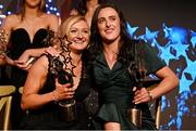 18 November 2023; TG4 LGFA All Star award winners Carla Rowe, left, and Hannah Tyrrell, both of Dublin, during the TG4 All-Ireland Ladies Football All Stars Awards banquet, in association with Lidl, at the Bonnington Dublin Hotel. Photo by Brendan Moran/Sportsfile