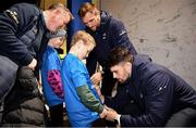 18 November 2023; Leinster players Jason Jenkins, second from right, and Harry Byrne, right, with supporters in Autograph Alley before the United Rugby Championship match between Leinster and Scarlets at the RDS Arena in Dublin. Photo by Sam Barnes/Sportsfile
