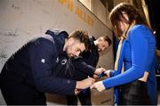 18 November 2023; Leinster players Harry Byrne, left, and Robbie Henshaw with supporters in Autograph Alley before the United Rugby Championship match between Leinster and Scarlets at the RDS Arena in Dublin. Photo by Sam Barnes/Sportsfile