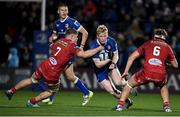 18 November 2023; Jamie Osborne of Leinster in action against Teddy Leatherbarrow, left, and Ben Williams of Scarlets during the United Rugby Championship match between Leinster and Scarlets at the RDS Arena in Dublin. Photo by Sam Barnes/Sportsfile