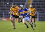 19 November 2023; Paul Flynn of Kiladangan in action against Jathan McMahon of Clonlara during the AIB Munster GAA Hurling Senior Club Championship Semi-Final match between Kiladangan, Tipperary, and Clonlara, Clare, at FBD Semple Stadium in Thurles, Tipperary. Photo by Stephen Marken/Sportsfile