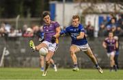 19 November 2023; Andy McGowan of Kilmacud Crokes in action against Ciarán Keenan of Ardee St Mary’s during the AIB Leinster GAA Football Senior Club Championship Semi-Final match between Ardee St Mary's, Louth, and Kilmacud Crokes, Dublin, at Pairc Mhuire in Ardee, Louth. Photo by Daire Brennan/Sportsfile