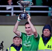 19 November 2023; Cathal Moriarty of Milltown-Castlemaine lifts the trophy after the Kerry County Intermediate Football Championship Final match between Fossa and Milltown/Castlemaine at Austin Stack Park in Tralee, Kerry. Photo by David Fitzgerald/Sportsfile