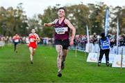 19 November 2023; Cormac Dalton of Mullingar Harriers AC, Westmeath, celebrates on his way to winning the Mens Senior 9000m during the 123.ie National Senior & Even Age Cross Country Championships at Gowran Demesne in Kilkenny. Photo by Ben McShane/Sportsfile
