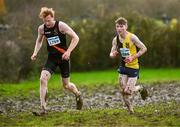 19 November 2023; Cathal O'reilly of Kilkenny City Harriers AC, Kilkenny, right, and Sean O'leary of Clonliffe Harriers AC, Dublin, competing in the Mens U23 9000m during the 123.ie National Senior & Even Age Cross Country Championships at Gowran Demesne in Kilkenny. Photo by Ben McShane/Sportsfile