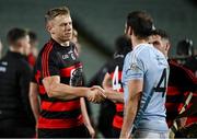 19 November 2023; Philip Mahony of Ballygunner, left, shakes hands with Cathal King of Na Piarsaigh after the AIB Munster GAA Hurling Senior Club Championship Semi-Final match between Na Piarsaigh, Limerick, and Ballygunner, Waterford, at TUS Gaelic Grounds in Limerick. Photo by Brendan Moran/Sportsfile