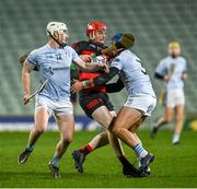 19 November 2023; Billy O'Keeffe of Ballygunner is tackled by Will Henn and Mike Casey of Na Piarsaigh during the AIB Munster GAA Hurling Senior Club Championship Semi-Final match between Na Piarsaigh, Limerick, and Ballygunner, Waterford, at TUS Gaelic Grounds in Limerick. Photo by Brendan Moran/Sportsfile