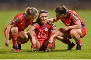 19 November 2023; Alex Kavanagh of Shelbourne is consoled by team-mates Kerri Letmon, left, and Jemma Quinn, right, after the Sports Direct FAI Women's Cup Final match between Athlone Town and Shelbourne at Tallaght Stadium in Dublin. Photo by Stephen McCarthy/Sportsfile