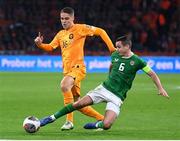 18 November 2023; Josh Cullen of Republic of Ireland in action against Joey Veerman of Netherlands during the UEFA EURO 2024 Championship qualifying group B match between Netherlands and Republic of Ireland at Johan Cruijff ArenA in Amsterdam, Netherlands. Photo by Seb Daly/Sportsfile
