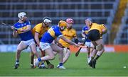 19 November 2023; Páraic O'Loughlin of Clonlara is fouled by Sean Hayes of Kiladangan during the AIB Munster GAA Hurling Senior Club Championship Semi-Final match between Kiladangan, Tipperary, and Clonlara, Clare, at FBD Semple Stadium in Thurles, Tipperary. Photo by Stephen Marken/Sportsfile