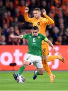 18 November 2023; Josh Cullen of Republic of Ireland in action against Teun Koopmeiners of Netherlands during the UEFA EURO 2024 Championship qualifying group B match between Netherlands and Republic of Ireland at Johan Cruijff ArenA in Amsterdam, Netherlands. Photo by Seb Daly/Sportsfile