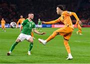 18 November 2023; Quilindschy Hartman of Netherlands in action against Alan Browne of Republic of Ireland during the UEFA EURO 2024 Championship qualifying group B match between Netherlands and Republic of Ireland at Johan Cruijff ArenA in Amsterdam, Netherlands. Photo by Stephen McCarthy/Sportsfile