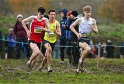 19 November 2023; Competitors, from left, Niall Murphy of Ennis Track AC, Clare, Jonas Stafford of UCD AC, Dublin, and Nick Griggs of CNDR Track Club AC, Antrim, compete in the Mens U18 & Junior 5000m during the 123.ie National Senior & Even Age Cross Country Championships at Gowran Demesne in Kilkenny. Photo by Ben McShane/Sportsfile