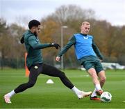 20 November 2023; Mark Sykes is tackled by Andrew Omobamidele, left, during a Republic of Ireland training session at the FAI National Training Centre in Abbotstown, Dublin. Photo by Stephen McCarthy/Sportsfile