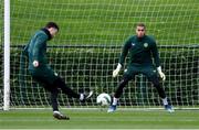 20 November 2023; Goalkeeper Gavin Bazunu faces a shot from Mikey Johnston during a Republic of Ireland training session at the FAI National Training Centre in Abbotstown, Dublin. Photo by Stephen McCarthy/Sportsfile