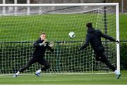 20 November 2023; Goalkeeper Mark Travers faces a shot from Troy Parrott during a Republic of Ireland training session at the FAI National Training Centre in Abbotstown, Dublin. Photo by Stephen McCarthy/Sportsfile