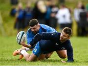 20 November 2023; Ross Byrne is tackled by Michael Milne during a squad training session on the Leinster Rugby 12 Counties Tour at Kilkenny College in Kilkenny. Photo by Harry Murphy/Sportsfile