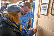 20 November 2023; Andrew Porter is shown a photograph of his father, Ernie Porter, a former pupil of the school, by Principal Emma Raughter after a squad training session on the Leinster Rugby 12 Counties Tour at Kilkenny College in Kilkenny. Photo by Harry Murphy/Sportsfile