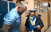 20 November 2023; Andrew Porter is shown a photograph of his father, Ernie Porter, a former pupil of the school, by Principal Emma Raughter after a squad training session on the Leinster Rugby 12 Counties Tour at Kilkenny College in Kilkenny. Photo by Harry Murphy/Sportsfile