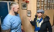 20 November 2023; Andrew Porter is shown a photograph of his father, Ernie Porter, a former pupil of the school, by Principal Emma Raughter after a squad training session on the Leinster Rugby 12 Counties Tour at Kilkenny College in Kilkenny. Photo by Harry Murphy/Sportsfile