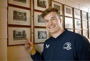 20 November 2023; Josh van der Flier with a photograph of his grandfather George Strong, who was a pupil at the school, after a squad training session on the Leinster Rugby 12 Counties Tour at Kilkenny College in Kilkenny. Photo by Harry Murphy/Sportsfile