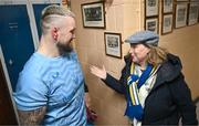 20 November 2023; Andrew Porter is shown a photograph of his father, Ernie Porter, a former pupil of the school, by Principal Emma Raughter after a squad training session on the Leinster Rugby 12 Counties Tour at Kilkenny College in Kilkenny. Photo by Harry Murphy/Sportsfile