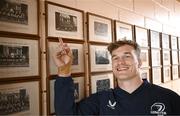 20 November 2023; Josh van der Flier with a photograph of his grandfather George Strong, who was a pupil at the school, after a squad training session on the Leinster Rugby 12 Counties Tour at Kilkenny College in Kilkenny. Photo by Harry Murphy/Sportsfile