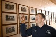 20 November 2023; Josh van der Flier with a photograph of his grandfather George Strong, who was a pupil at the school, after a squad training session on the Leinster Rugby 12 Counties Tour at Kilkenny College in Kilkenny. Photo by Harry Murphy/Sportsfile