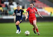 19 November 2023; Hannah Healy of Shelbourne in action against Laurie Ryan of Athlone Town during the Sports Direct FAI Women's Cup Final match between Athlone Town and Shelbourne at Tallaght Stadium in Dublin. Photo by Stephen McCarthy/Sportsfile